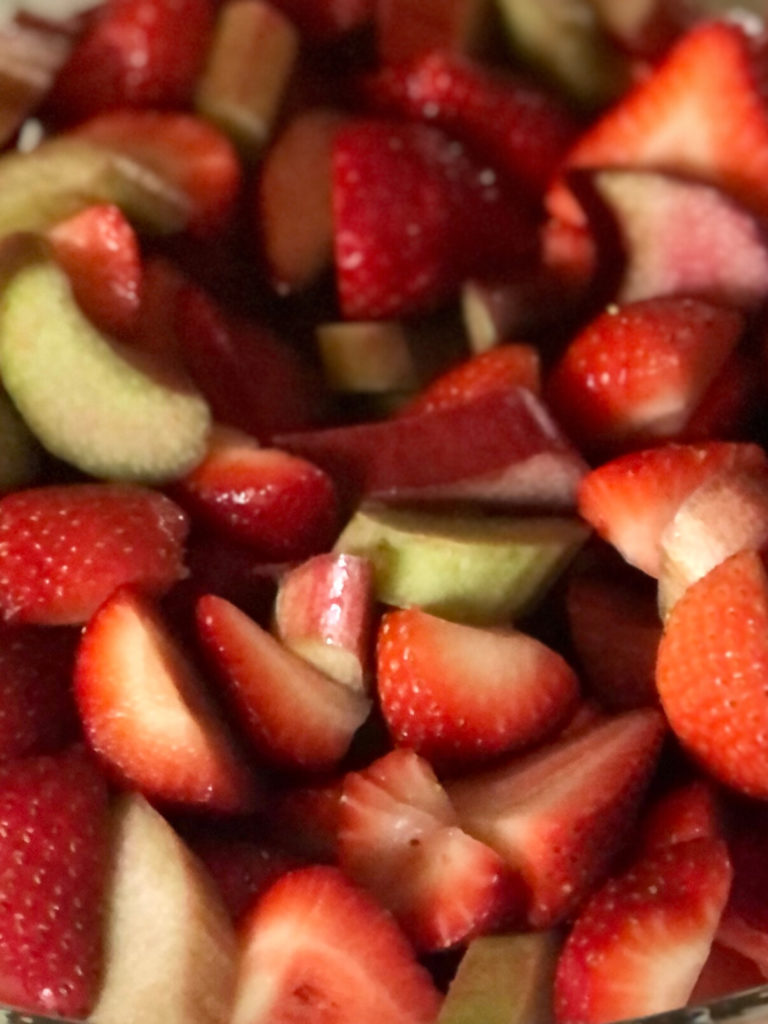 Closs up picture of sliced strawberries and rhubarb.